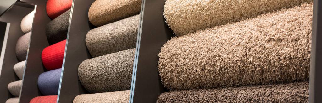 Rolls of carpet on display